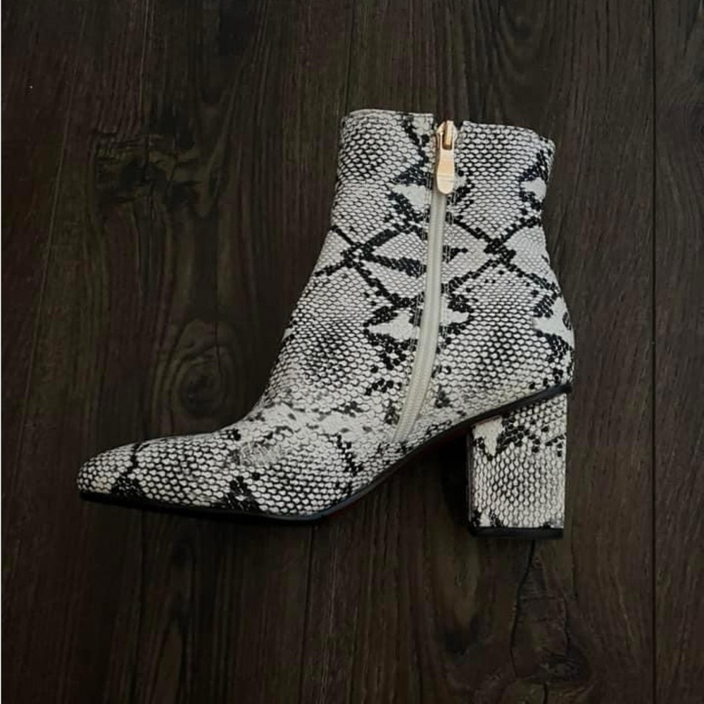 snake skin booties with red on the bottoms. Like new, only have been worn once.
